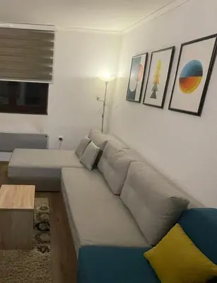 a living room with a couch and a table at Bela Reka Gondola Studio in Brzeće
