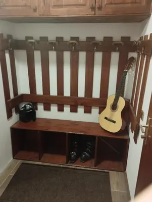 a guitar sitting on a bench in a room at Bela Reka Gondola Studio in Brzeće