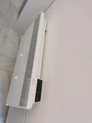 a white computer monitor hanging from a ceiling at Apartman Aleksandar 1 in Ribarska Banja