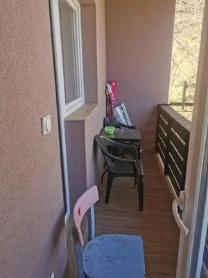 a room with a desk and a chair next to a window at Apartman Aleksandar 1 in Ribarska Banja