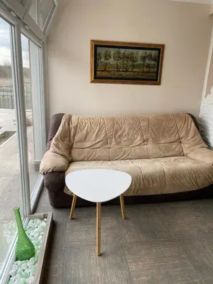 a living room with a couch and a table at Diamona Lux Spa Apartman in Niš