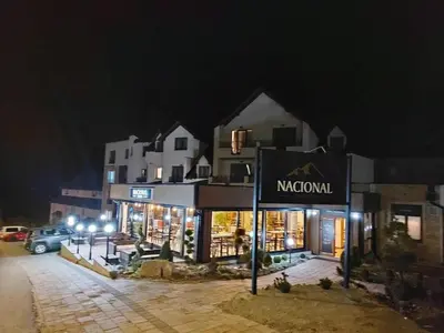 a building with a sign for at Apartman N Lux 100 Milmari resort in Kopaonik