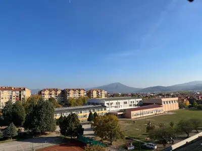 a view of a city with buildings and trees at Art Studio in Niš