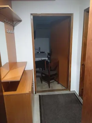 a room with a table and a dining room at Apartman MARA in Bor