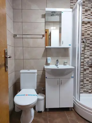 a bathroom with a toilet and a sink at Apartman SN in Vrnjačka Banja