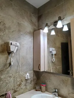 a bathroom with a sink and a mirror at Studio Kalina in Vrnjačka Banja