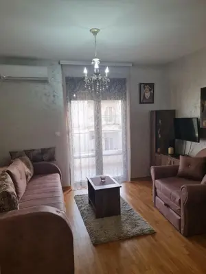 a living room with a couch and a coffee table at Studio Kalina in Vrnjačka Banja