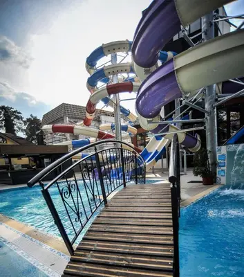 a slide in a water park with a pool at Studio apartman Sara in Vrnjačka Banja