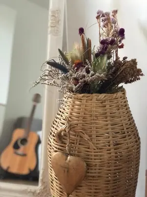 a wicker basket with a heart and flowers in it at Tesla 30 in Kruševac