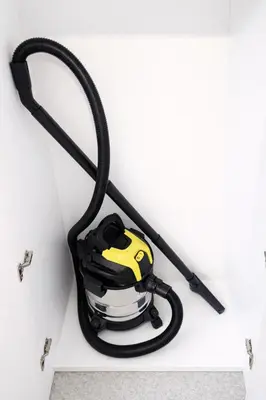 a black and yellow hoses hanging on a wall at Nilton 2 Apartmans in Niš