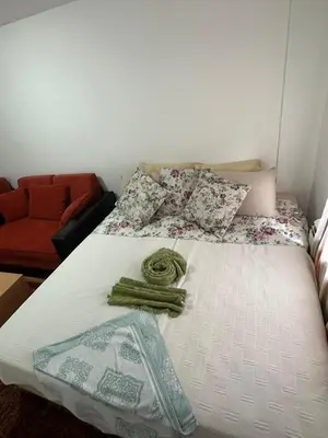 a bed in a room with a bed sidx sidx sidx at Apartmani Ušće in Trstenik