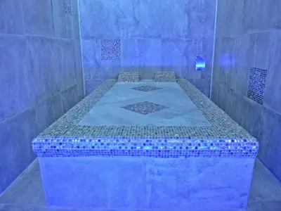 a room with a bed in a blue room at Guesthouse Đokić in Leskovac