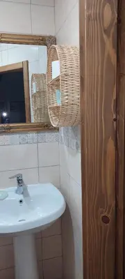 a bathroom with a sink and a mirror at Golemi kamik Pirot Vlasi 4 in Pirot