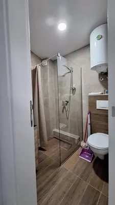 a bathroom with a shower and a toilet at Kopaonik - Milmari resort S65 in Kopaonik