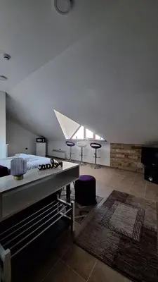 a room with a bed and a table and chairs at Kopaonik - Milmari resort S65 in Kopaonik