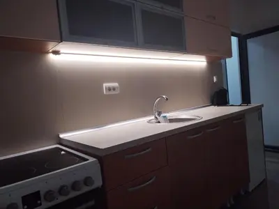 a small kitchen with a sink and a stove at Junona Magenta in Prokuplje