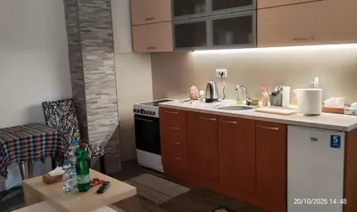 a kitchen with a sink and a stove at Junona Magenta in Prokuplje
