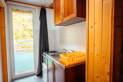 a small kitchen with a sink and a window at STD Stara Vodenica in Crni Vrh
