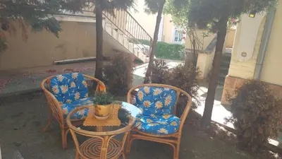 two chairs and a table and a table and a table and chairs at Mrvica in Vrnjačka Banja