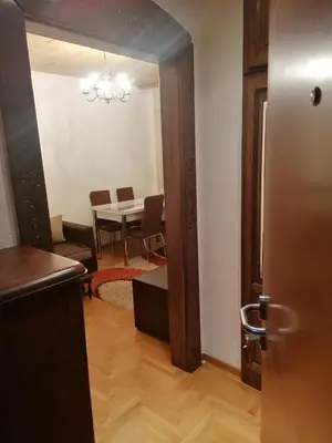 an open door to a dining room with a table at Etno-urban stan na dan in Paraćin
