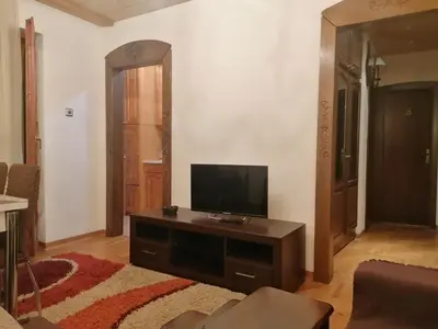 a living room with a flat screen tv on a table at Etno-urban stan na dan in Paraćin