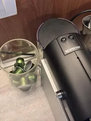 a close up of a juicer next to a bowl of green peppers at Apartmani Kilijan Kopaonik in Kopaonik