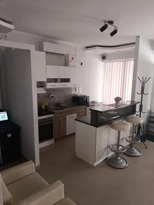 a kitchen with a counter and a counter top at Apartman Lara in Kuršumlija