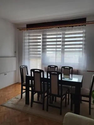 a dining room with a table and chairs at Apartman MIKA in Zaječar