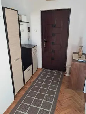 a room with a door and a table and a floor at Apartman MIKA in Zaječar