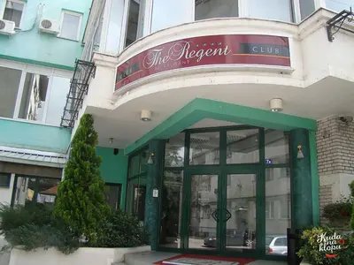 a store front of a building with a sign on it at Yellow Diamond in Niš