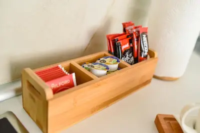 a wooden tray with tools on a table at BAGDALA RESIDENCE APARTMAN in Kruševac