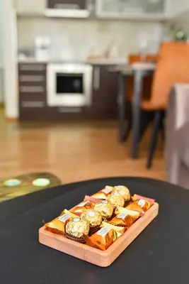 a tray of gold bars on a table at BAGDALA RESIDENCE APARTMAN in Kruševac