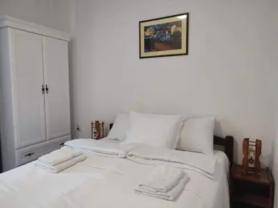 a white bed with two white towels on it at B&B Vila Babin zub in Balta Berilovac