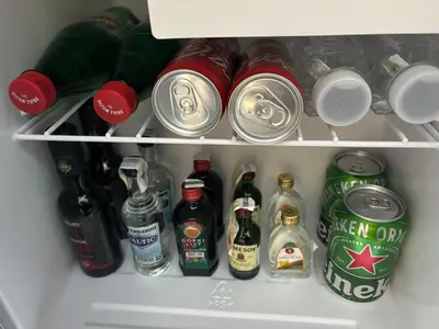 a refrigerator filled with lots of bottles of alcohol at Stan na dan Kutak in Raška