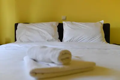 a banana sitting on top of a bed at Apartmani Ad fines in Kuršumlija