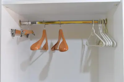 a group of kitchen utensils hanging on a rack at Apartmani Ad fines in Kuršumlija
