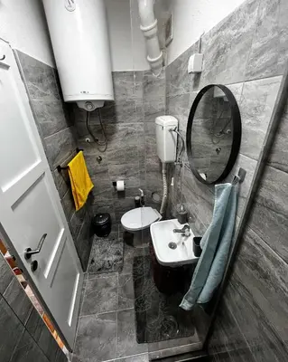 a bathroom with a sink and a mirror at Apartman RISTIC in Vranje