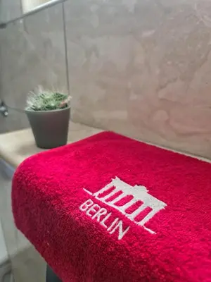 a red towel with the new york yankees on it at Apartman Berlin Sokobanja 2 in Soko Banja