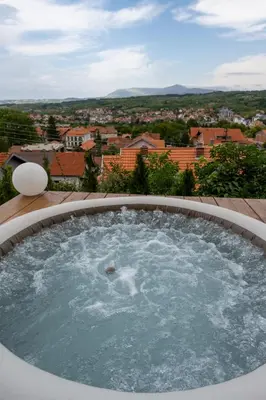 a hot tub with a view of a city at Apartman Berlin Sokobanja 2 in Soko Banja