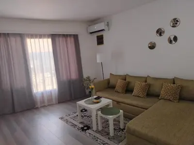 a living room with a couch and a table at Passage in Paraćin