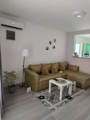 a living room with a couch and a table at Passage in Paraćin