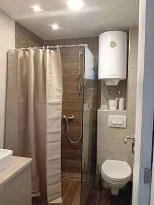 a bathroom with a shower with a toilet and a sink at Studio Ristic Milmari L5 in Kopaonik