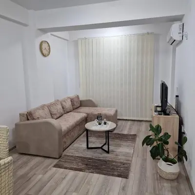 a living room with a couch and a table at Emili lux in Jagodina