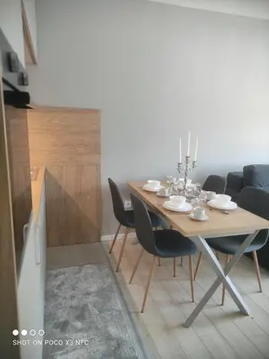 a dining room with a table and chairs at Central Lux ( U CENTRU GRADA, 30m od SPA centra) in Soko Banja