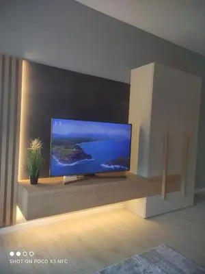 a living room with a large flat screen tv at Central Lux ( U CENTRU GRADA, 30m od SPA centra) in Soko Banja