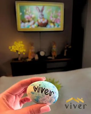 a person holding a rock with the word giveaway on it at Apartmani Viver Vrnjačka Banja in Vrnjci