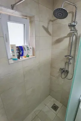 a bathroom with a shower stall with a shower at Apartman VRH in Vrnjačka Banja