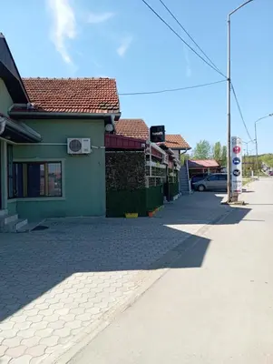 an empty street in a town with a gas station at Marko Konak in Niš