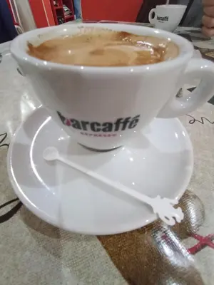 a cup of coffee sitting on a saucer at Marko Konak in Niš