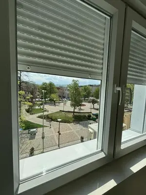 a window with a view of a street at Apartman Centar in Kuršumlija